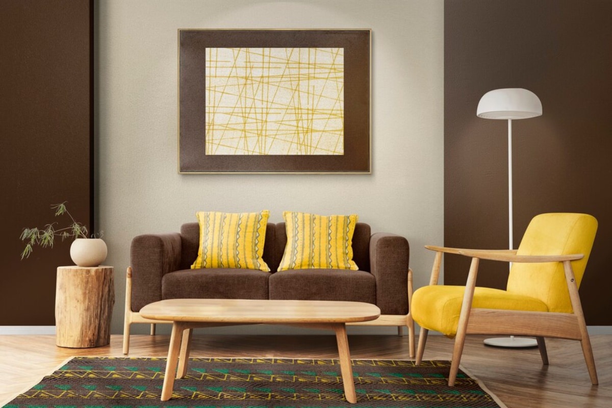 Stylish living room with a brown sofa, yellow chair, geometric rug, and a modern artwork on the wall.