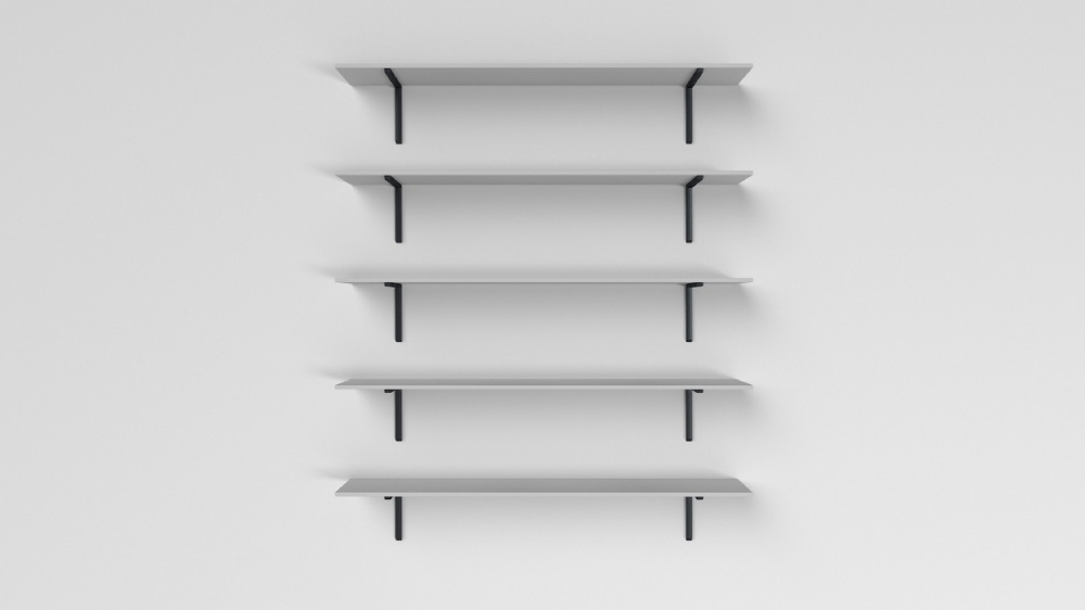   Five empty white shelves mounted on a plain white wall.